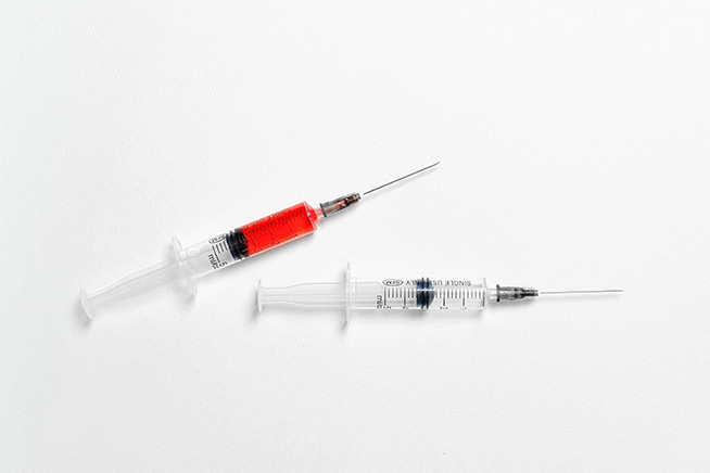 two injection syringes on white surface - black seed oil benefits for your face article