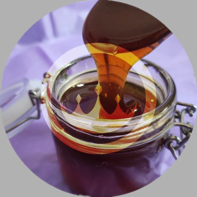 zoom-in on wildflower and black seed honey in wholesale distribution sized jars